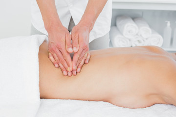 Obraz na płótnie Canvas Closeup of a physiotherapist massaging womans back