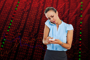 Businesswoman having a phone call and taking notes against stocks and shares