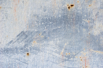 Unevenly colored wall. Paint smears on wall texture. Grey abstract background