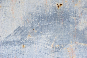 Fototapeta premium Unevenly colored wall. Paint smears on wall texture. Grey abstract background