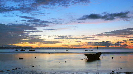 Fishing boat in the sea at sunrise