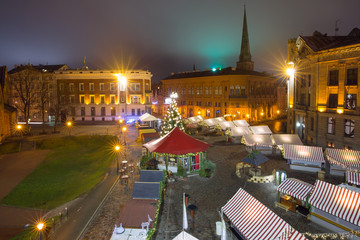 Fototapeta premium Aerial view of the decorated and illuminated Christmas tree, Christmas Market on the Cathedral Square, Doma laukums, Riga, Latvia.
