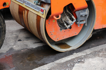 Close up road rollers compacting  asphalt