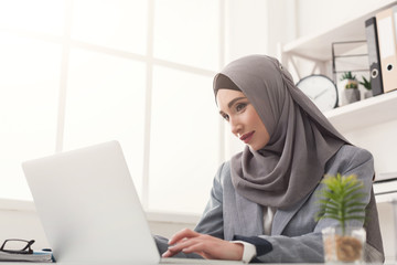 Arabic businesswoman in hijab working at office