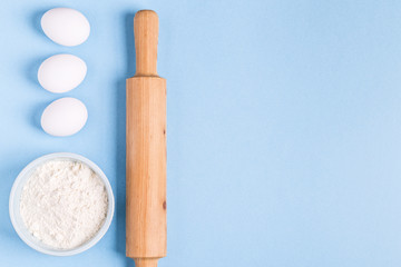 Ingredients for baking  on a blue background.