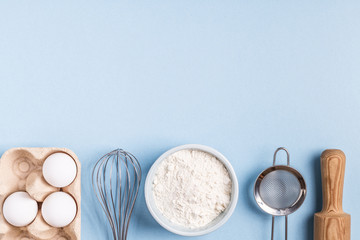 Ingredients for baking  on a blue background.