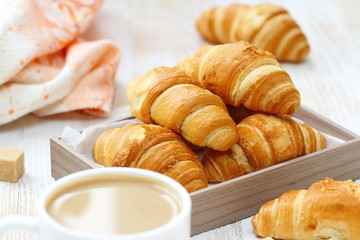 White coffee and croissant for breakfast