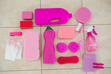Overhead view of pink color cleaning equipment on floor