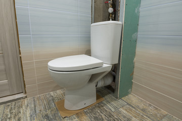 Temporarily installed toilet on the carton in the toilet to be repaired