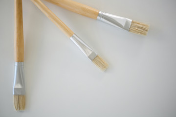 Fototapeta premium Paintbrushes arranged on white background