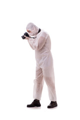 Forensic specialist in protective suit taking photos on white