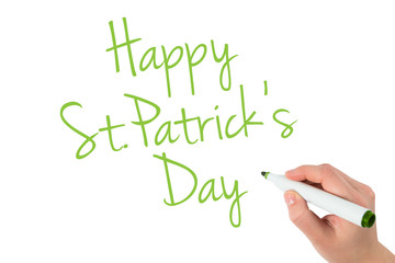 Businesswomans hand writing with marker against happy st patricks day