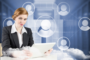 Redhead businesswoman using her tablet pc against white lock with icons in hallway