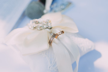 beautiful gold wedding rings on the bride's preparations