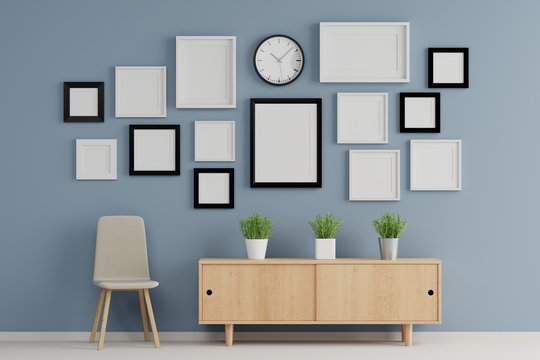 Blank group of  picture frame for insert text or image inside on wood table in living room.