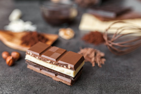 Delicious variety of chocole on rustic background