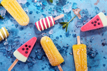 Colorful popsicle or Vanilla frozen yogurt or soft ice cream.