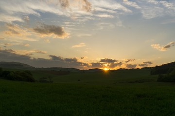 Fototapeta premium Sunset on meadow with hills and tree. Slovakia