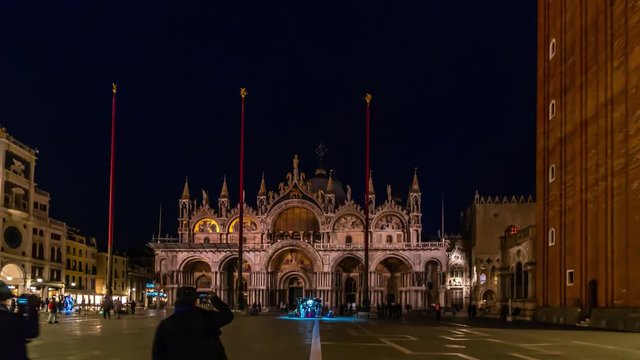 Piazza San Marco and Basilica of St Mark night timelapse. It is cathedral church of Roman Catholic Archdiocese of Venice. Tourists walking in front of it. 4K