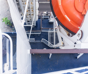 Lifeboat and liferafts on deck of a ship