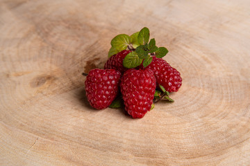 raspberry berries on wooden background