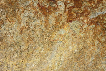 Natural stone granite texture, granite pattern. Stone background of mottled granite igneous rock used for kitchen worktops etc. Surface of the marble with brown tint