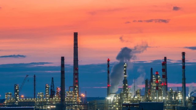 Industrial zone the equipment of oil refining at sunset. Timelapse 4K