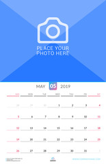 Wall calendar for May 2019. Vector design print template with place for photo. Week starts on Sunday. Portrait orientation