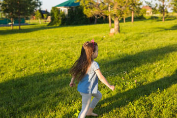 happy child runs in summer park