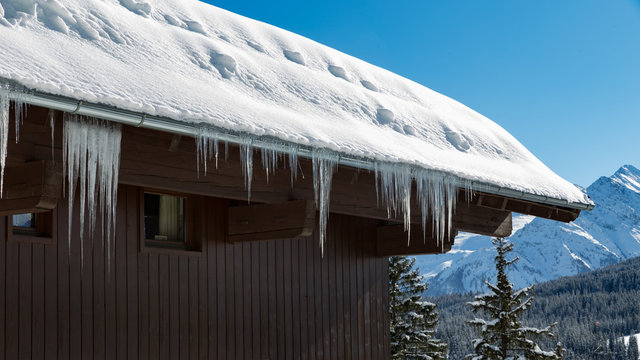 large icycles on an alpine hut