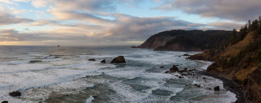 Panoramic Seascape view of a Beautiful Pacific Ocean Coast with a rugged rocky formation. Taken in Ecola State Park, Seaside, Cannon Beach, Oregon, USA.