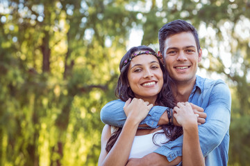 Fototapeta premium Cute couple smiling in the park