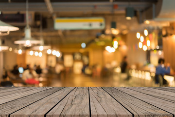 old vintage grungy brown wood panel tabletop with blurred restaurant bar cafe light color background for show,promote and advertise product on display