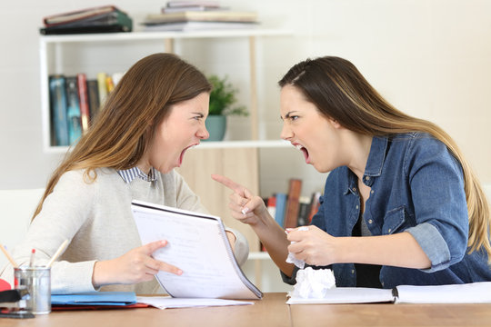 Two students arguing doing homework