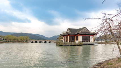 Fototapeta na wymiar bridge and pagoda at beihu lake, china