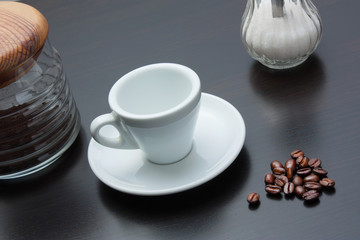 pile of coffee beans and a cup