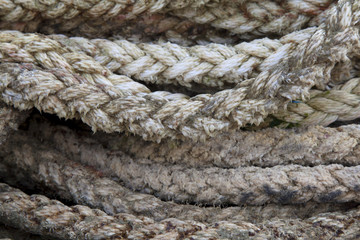 Thick braided rope. Texture of a braided rope. Fishing net.