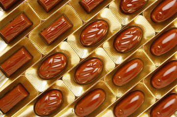 chocolate candies in a gold gift box