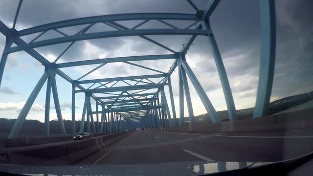 Driving over a industrial bridge om overcast spring day with go pro