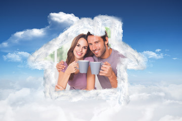 Couple looking at the camera with a coffee against bright blue sky with clouds