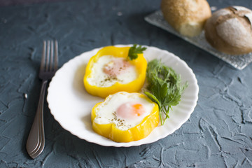 Close up scrambled eggs in bell pepper on the plate
