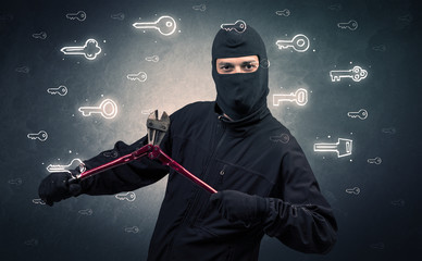 Burglar standing with tools in his hand.