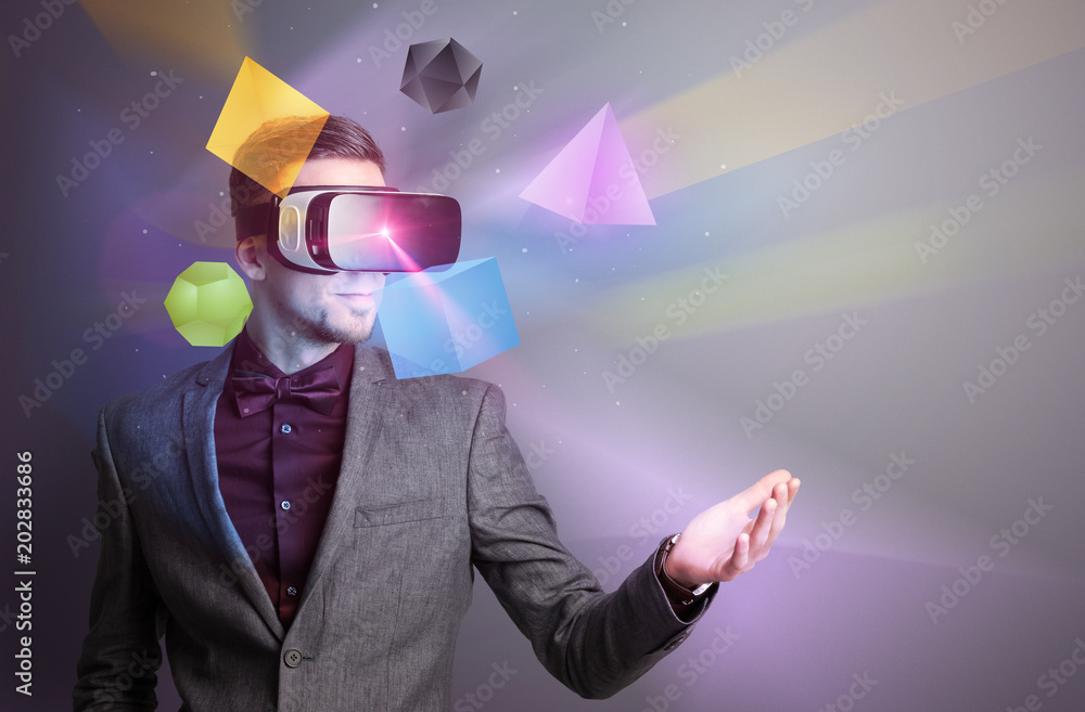 Poster amazed businessman with virtual reality colorful geometric shapes in front of him
