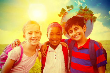 Fototapeta premium Little school kids in school corridor against blue sky over green field