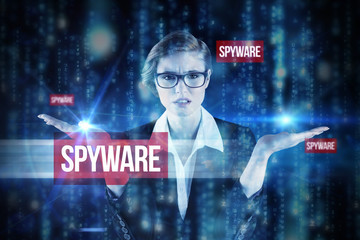 Fototapeta na wymiar The word spyware and businesswoman holding hand out in presentation against lines of blue blurred letters falling