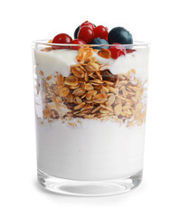 Glass with yogurt, berries and granola on white background