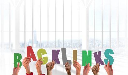 Hands holding up bank links against white room with large window overlooking city