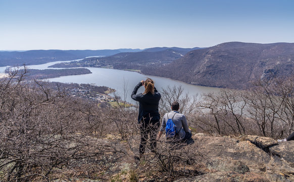Young couple overlooking Hudson River at Bull Hill near Cold Spring, NY