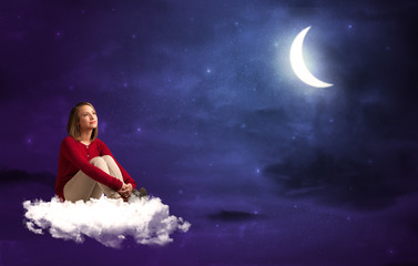 Fototapeta na wymiar Caucasian woman sitting and wondering on a white cloud, under the moonshine