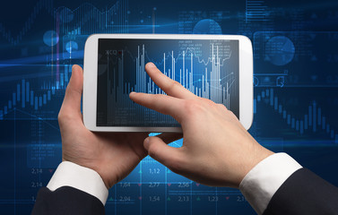 First person hand using tablet and checking financial report on cloud computing system
